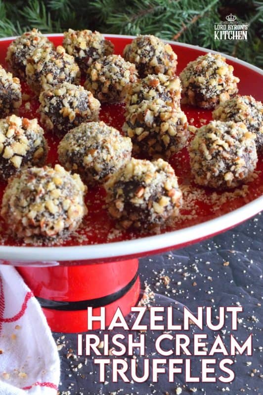 Hazelnut Irish Cream Truffles are decadent, rich, and densely chocolaty. The creaminess and meltiness of the chocolate ganache mixture contrasts very well with the slight saltiness and crunchiness of the toasted hazelnuts. With just a touch of Irish Cream, these truffles are suitable for all ages! #nobake #truffles #christmas #holiday #boozy #chocolate #baileys #irishcream