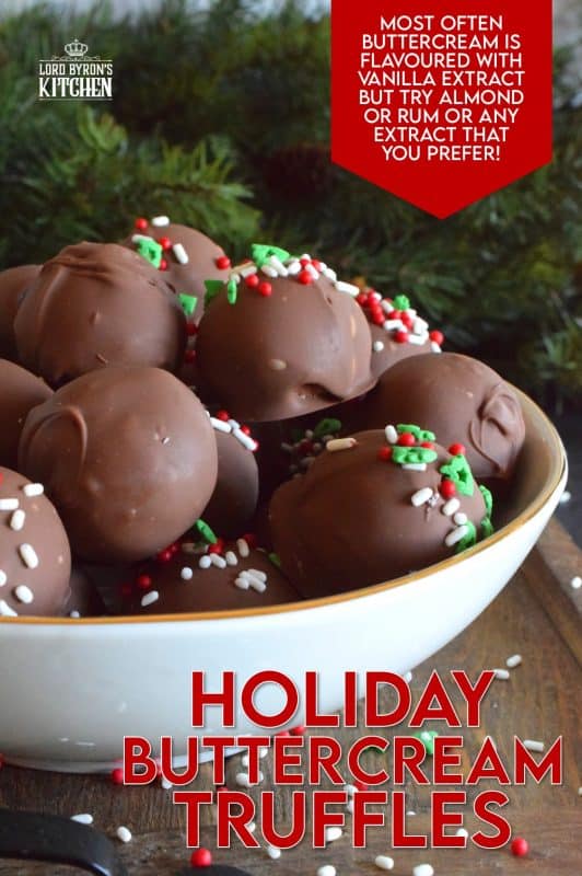 When it comes to truffles that melt in your mouth, Holiday Buttercream Truffles are the best! The bright white centers are prepared with cream cheese and butter, just like the beginnings of a good cake frosting! Dipped in melted milk chocolate, it's hard to eat just one of these! #truffles #buttercream #cookies #nobake #christmas #holiday #chocolate