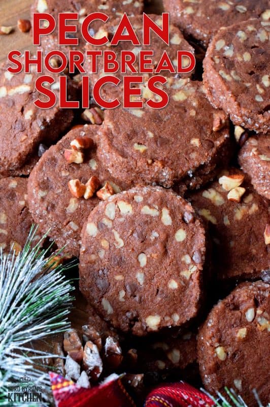 Pecan Shortbread Slices are one of those cookies you can make long in advance. They are rolled into a log, well wrapped, and can be refrigerated or frozen until you feel like baking. They are packed with toasted pecans and prepared with good cocoa and mini chocolate chips for extra chocolatey flavour. #shortbread #christmas #holiday #baking #cookies #chocolate #freezer #slices