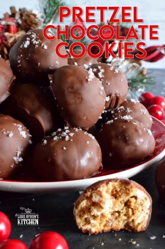 This is a cookie that has been baked into a ball and then dipped into melted chocolate and topped with flaked sea salt. If you love the combination of salty and sweet, than Pretzel Chocolate Cookies are for you! #christmas #holiday #baking #cookie #balls #chocolate #pretzels #cookieexchange