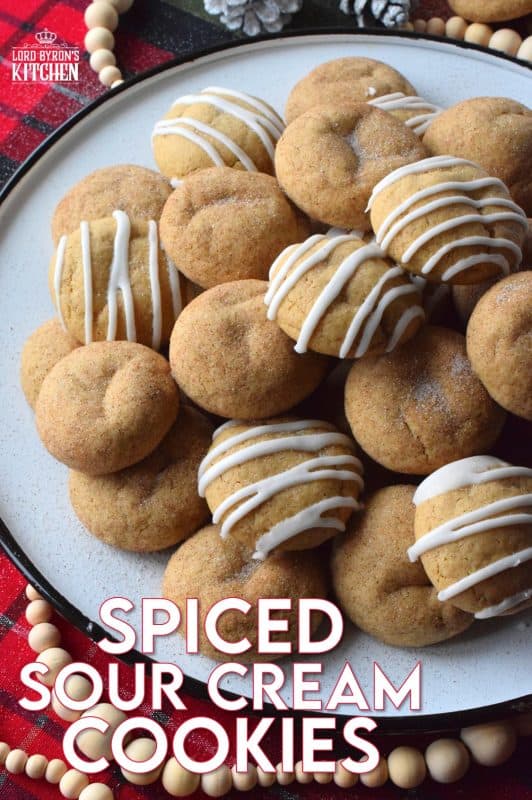A soft, chewy cookie prepared with sour cream and familiar, warming, Christmastime spices. Spiced Sour Cream Cookies are loaded with cinnamon, cloves, ginger, and nutmeg too, which makes them a very comforting and cozy confection! The drizzled glaze is completely optional too! #christmas #holiday #baking #spiced #cookies #chewycookies