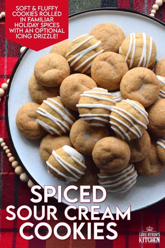 A soft, chewy cookie prepared with sour cream and familiar, warming, Christmastime spices. Spiced Sour Cream Cookies are loaded with cinnamon, cloves, ginger, and nutmeg too, which makes them a very comforting and cozy confection! The drizzled glaze is completely optional too! #christmas #holiday #baking #spiced #cookies #chewycookies
