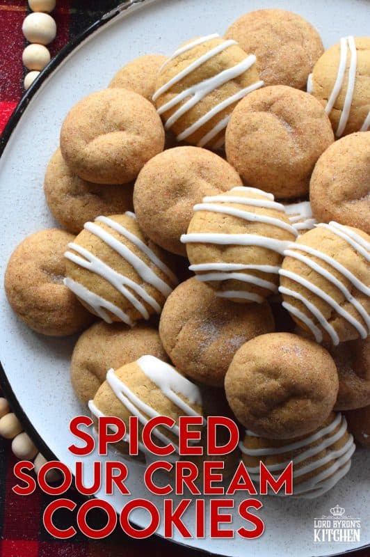 A soft, chewy cookie prepared with sour cream and familiar, warming, Christmastime spices. Spiced Sour Cream Cookies are loaded with cinnamon, cloves, ginger, and nutmeg too, which makes them a very comforting and cozy confection! The drizzled glaze is completely optional too! #christmas #holiday #baking #spiced #cookies #chewycookies