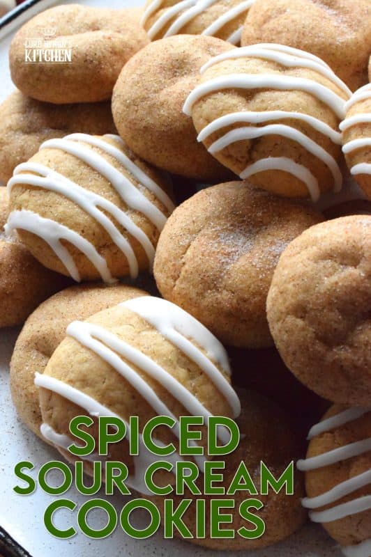 A soft, chewy cookie prepared with sour cream and familiar, warming, Christmastime spices. Spiced Sour Cream Cookies are loaded with cinnamon, cloves, ginger, and nutmeg too, which makes them a very comforting and cozy confection! The drizzled glaze is completely optional too! #christmas #holiday #baking #spiced #cookies #chewycookies