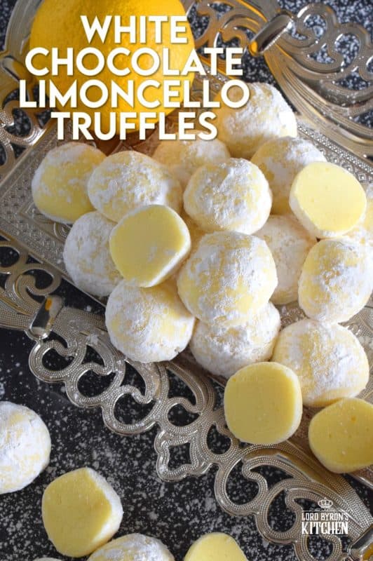 If you love lemon, White Chocolate Limoncello Truffles will make you a very happy person! Prepared with white chocolate, lemon zest, and limoncello liqueur, these truffles are perfectly sweet and sour. These pale yellow delights will melt in your mouth! #christmas #whitechocolate #holiday #nobake #truffles #limoncello #boozy