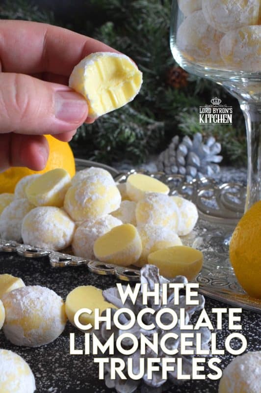 If you love lemon, White Chocolate Limoncello Truffles will make you a very happy person! Prepared with white chocolate, lemon zest, and limoncello liqueur, these truffles are perfectly sweet and sour. These pale yellow delights will melt in your mouth! #christmas #whitechocolate #holiday #nobake #truffles #limoncello #boozy