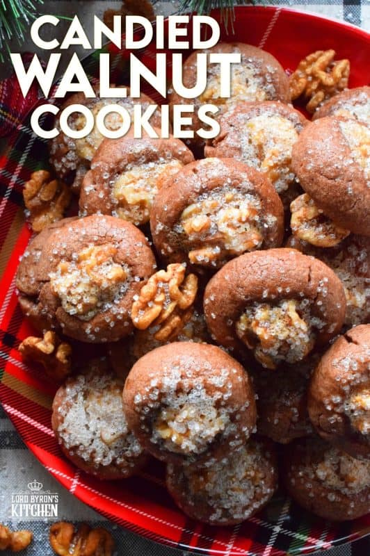 These chocolate cookies are baked with a whole candied walnut right in the center. The cookie is chocolatey and chewy, but the walnut is sweet and crunchy. Paired together, they make these Candied Walnut Cookies something extraordinary - despite the fact that they look like stuffed mushrooms! #walnuts #candied #christmas #candiednuts #baking #holiday