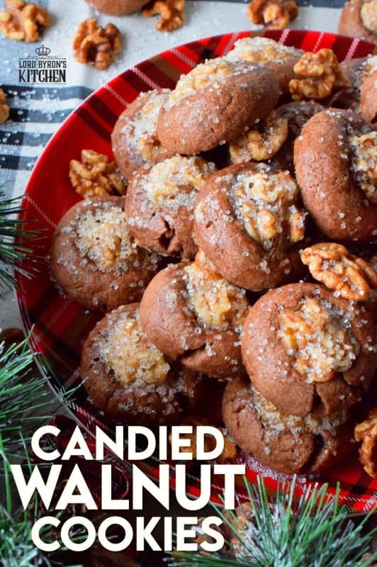 These chocolate cookies are baked with a whole candied walnut right in the center. The cookie is chocolatey and chewy, but the walnut is sweet and crunchy. Paired together, they make these Candied Walnut Cookies something extraordinary - despite the fact that they look like stuffed mushrooms! #walnuts #candied #christmas #candiednuts #baking #holiday