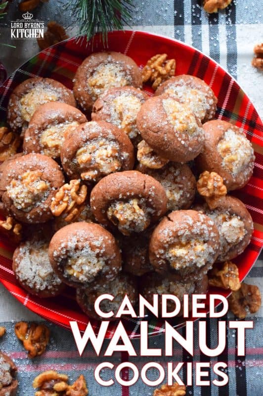 These chocolate cookies are baked with a whole candied walnut right in the center. The cookie is chocolatey and chewy, but the walnut is sweet and crunchy. Paired together, they make these Candied Walnut Cookies something extraordinary - despite the fact that they look like stuffed mushrooms! #walnuts #candied #christmas #candiednuts #baking #holiday