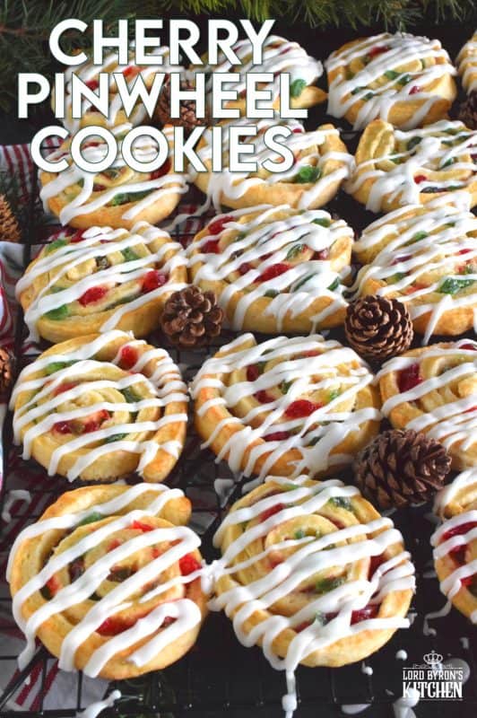 One of my favourite Christmas ingredients is being put to great use today! Cherry Pinwheel Cookies are made with a light, biscuit-like dough and rolled with red and green candied cherries. Drizzled with a basic sweet icing, these are absolutely delicious and very festive too! #christmas #holiday #baking #cherries #candiedcherries #cherry #redandgreen #drizzle