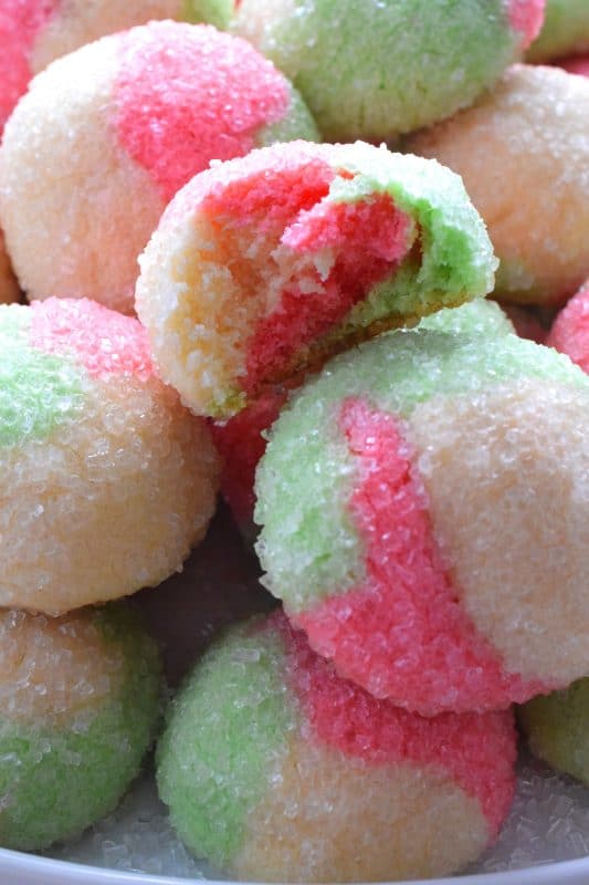 Holiday Neopolitan Cookies are two-bite cookies made with red, green, and white cookie dough. They are rolled in sugar and baked for a cute and festive Christmas confection. Use different extracts in each dough colour or prepare them with just good vanilla! #neopolitan #christmas #holiday #cookies #redandgreen