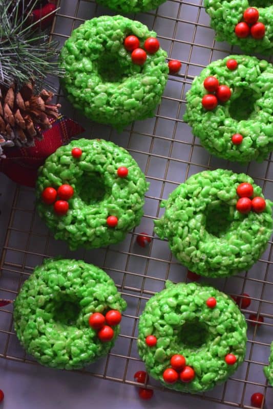 At its basic form, Holiday Wreath Treats are just beautified Rice Krispies Treats. With the help of marshmallows, butter, and green food colouring, these beautiful no-bake cookies are perfect for Christmastime snacking! #christmas #holiday #nobake #treats #marshmallow