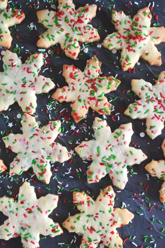 This easy-to-make cookie looks great and tastes even better! Using only four ingredients, Rolled Snowflake Cookies are for those who love to make holiday cookies with rolling pins and cookie cutters. No frosting skills needed here! #christmas #holiday #cookies #cookiecutter