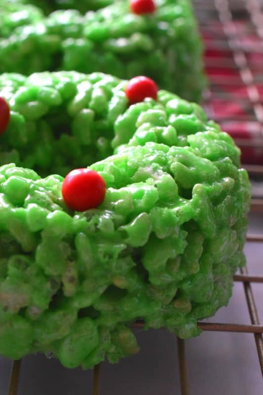 At its basic form, Holiday Wreath Treats are just beautified Rice Krispies Treats. With the help of marshmallows, butter, and green food colouring, these beautiful no-bake cookies are perfect for Christmastime snacking! #christmas #holiday #nobake #treats #marshmallow