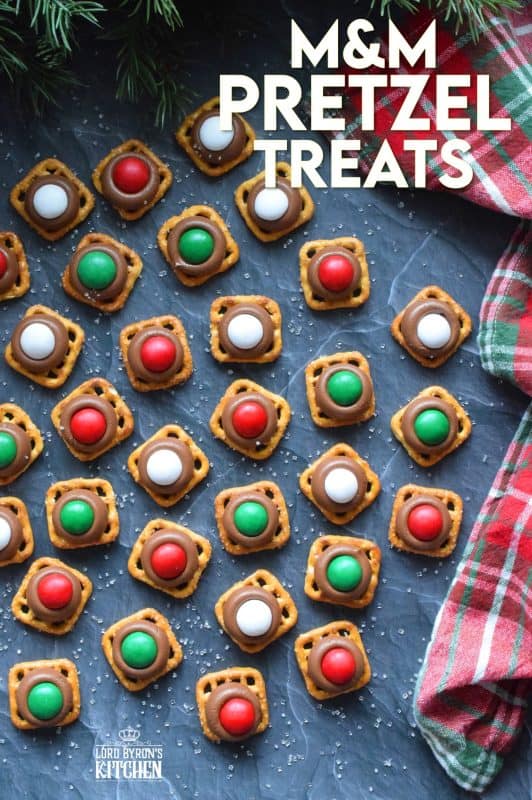 With only three ingredients, M&M Pretzel Treats are one of those no-bake confections that can be made in just a few minutes. It requires very little clean up, and you can change up the colours and flavours quite easily. Be sure to add these to your Christmas Eve treat table! #nobake #treats #M&M #christmas #holiday #chocolate #pretzels