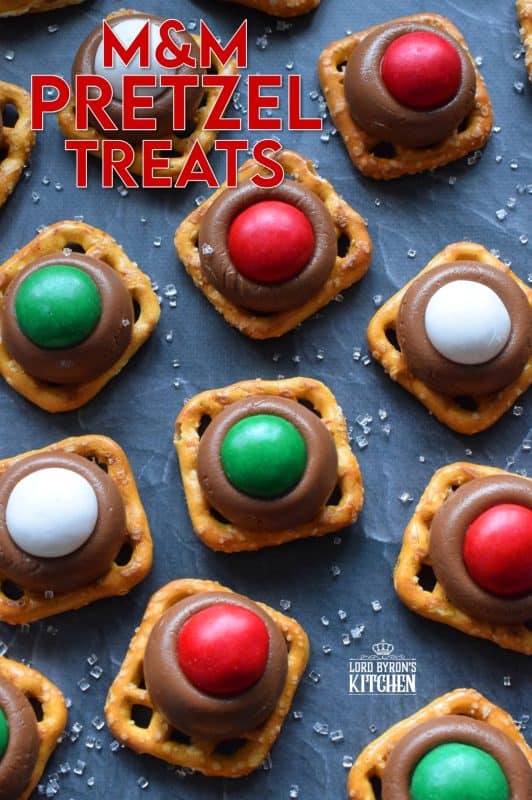 With only three ingredients, M&M Pretzel Treats are one of those no-bake confections that can be made in just a few minutes. It requires very little clean up, and you can change up the colours and flavours quite easily. Be sure to add these to your Christmas Eve treat table! #nobake #treats #M&M #christmas #holiday #chocolate #pretzels