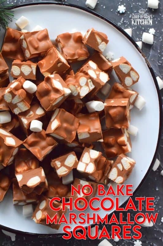 In all probability, this will be the best thing you will eat this holiday season. No Bake Chocolate Marshmallow Squares are prepared with only four ingredients and comes together in just minutes with the help of a microwave. These are decadent and rich, and you won't be able to stop eating them! #christmas #holidays #chocolate #nobake #peanutbutter #treats