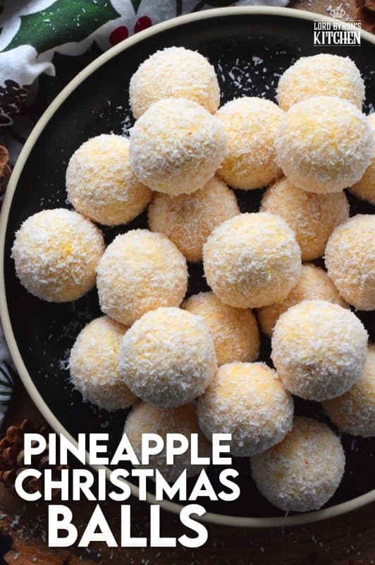 For some people, Christmas isn't all about snow covered hills and warm, cozy cottages in the countryside. For some people, Christmas is warm and sunny, and filled with tropical flavours, just like the flavours found in these Pineapple Christmas Balls! #christmas #holiday #nobake #balls #pineapple #tropical