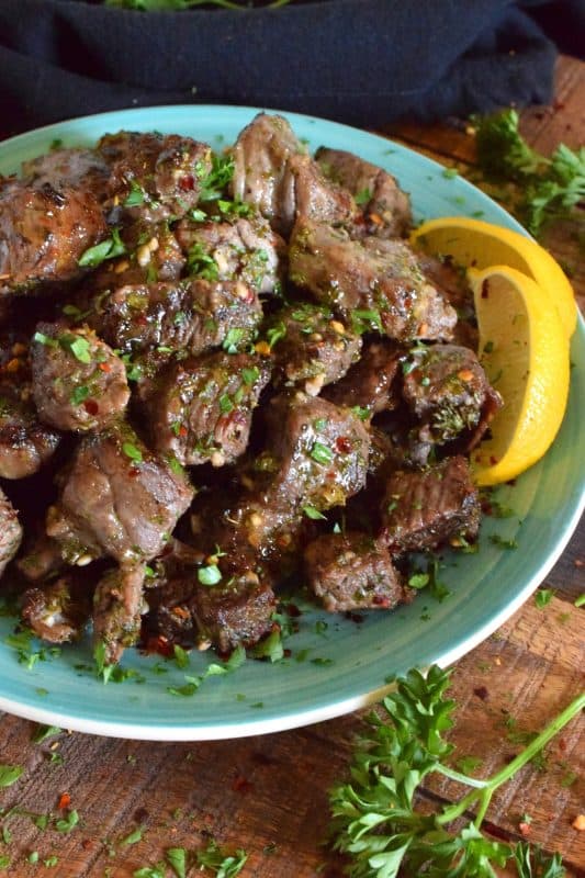 A simple marinade, a little patience, and a very hot oven are all you need to prepare these Roasted Herbed Beef Tips. Use a good cut of beef for the most tender bites! Can be marinated for up to 12 hours and takes just 20 minutes to roast, so this is a great option for a weeknight family dinner! #beef #tips #herbed #sirloin #roasted #baked #tender #marinade