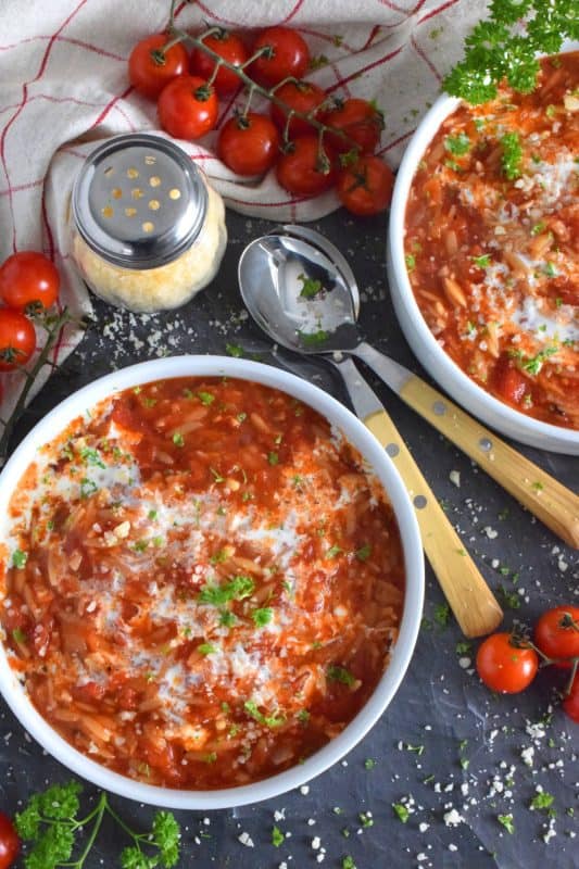 With a creamy tomato base, and its homey and comforting flavour, Orzo Tomato Soup is prepared in thirty minutes and is gloriously delicious! Packed with chopped tomatoes, onion, garlic, and pasta, this soup is both hearty and comforting - a perfect supper on a cold, winter weeknight! #soup #orzo #pasta #tomato