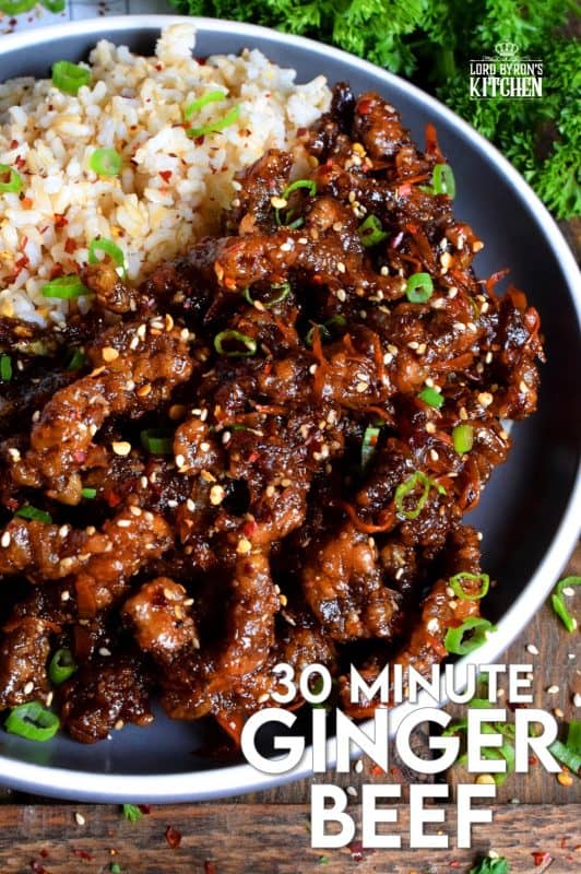Thinly sliced beef, fried until crispy, and coated in a sweet and slightly spicy garlic and ginger sauce; 30 Minute Ginger Beef is an inexpensive dinner the whole family will love! #ginger #beef #takeout #homemade #garlic #fried #crispy