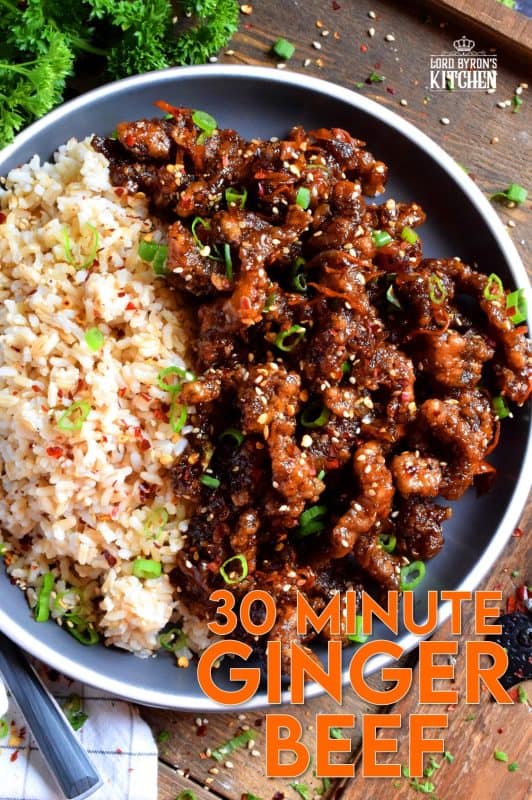 Thinly sliced beef, fried until crispy, and coated in a sweet and slightly spicy garlic and ginger sauce; 30 Minute Ginger Beef is an inexpensive dinner the whole family will love! #ginger #beef #takeout #homemade #garlic #fried #crispy