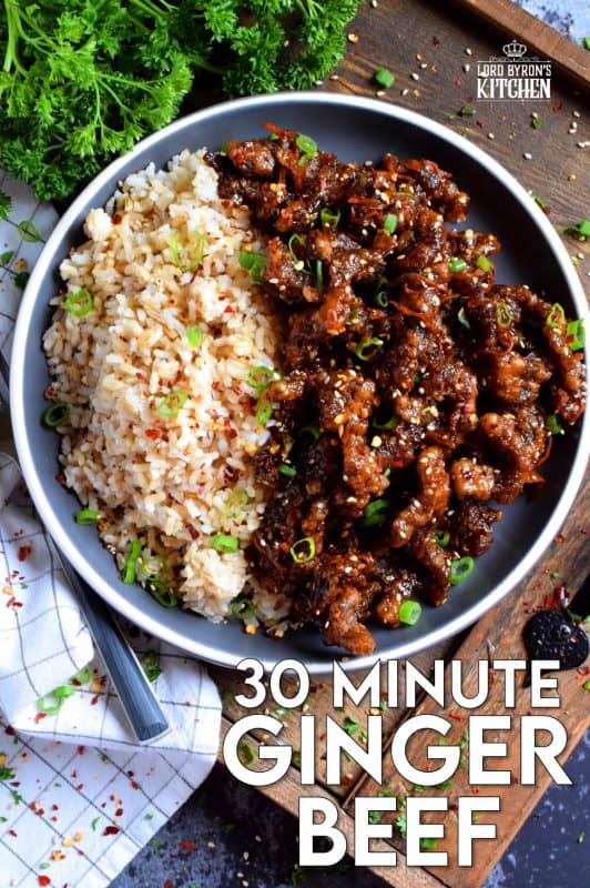 Thinly sliced beef, fried until crispy, and coated in a sweet and slightly spicy garlic and ginger sauce; 30 Minute Ginger Beef is an inexpensive dinner the whole family will love! #ginger #beef #takeout #homemade #garlic #fried #crispy