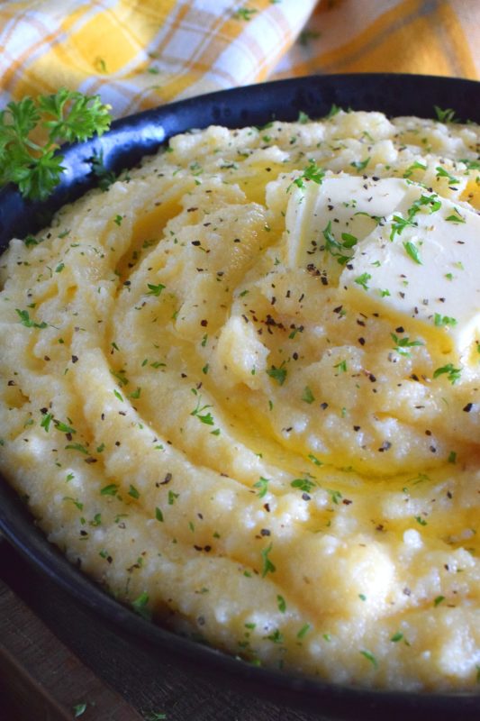 In colder months, one craves food that is heavier and heartier. Peppery Creamy Polenta is certainly that type of food. It is warming and comforting, and prepared with lots of fresh ground black pepper, butter, and cheese. A perfect winter side, especially when served with beef! #polenta #sides #sidedish #creamy