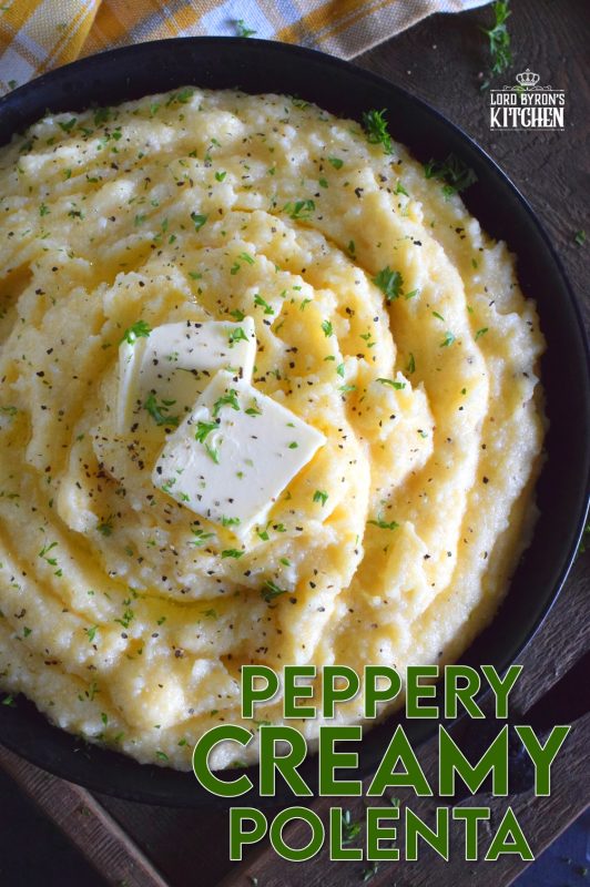 In colder months, one craves food that is heavier and heartier. Peppery Creamy Polenta is certainly that type of food. It is warming and comforting, and prepared with lots of fresh ground black pepper, butter, and cheese. A perfect winter side, especially when served with beef! #polenta #grits #creamy #cornmeal #sides #vegetarian #sidedishes
