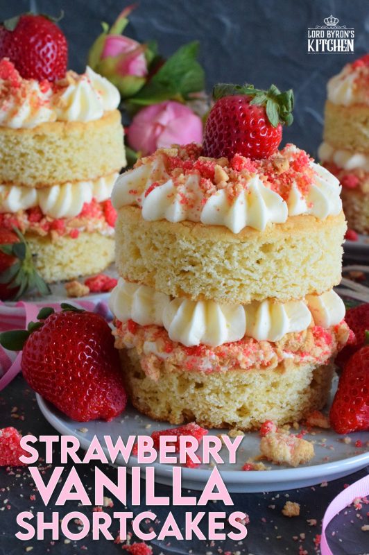 These gorgeous mini individual-sized cakes are super easy to make and look quite impressive. Stacked Vanilla Strawberry Shortcakes are prepared with vanilla sheet cake, strawberry shortcake crumbs, buttercream frosting, and fresh strawberries. You're going to love these shortcakes! #strawberry #strawberryshortcake #cake #stackedcake #layeredcake #valentines