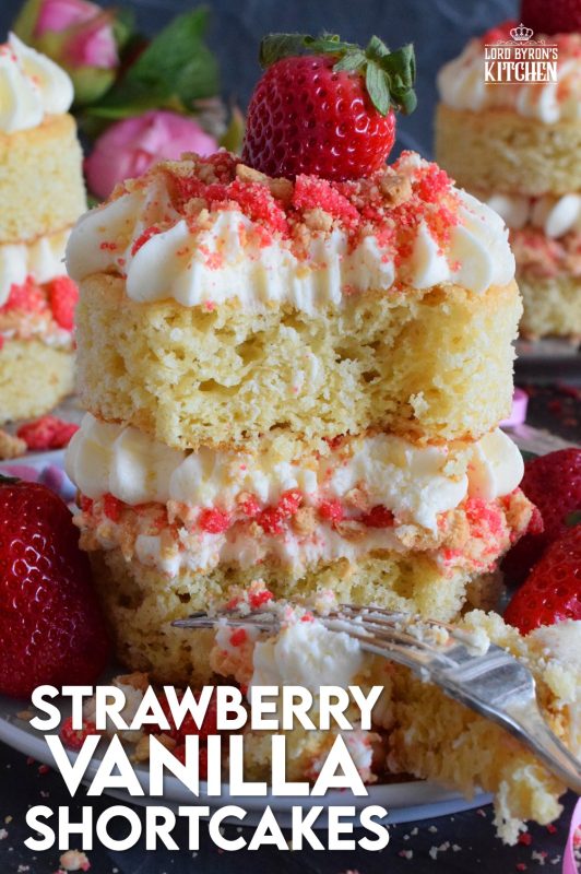 These gorgeous mini individual-sized cakes are super easy to make and look quite impressive. Stacked Vanilla Strawberry Shortcakes are prepared with vanilla sheet cake, strawberry shortcake crumbs, buttercream frosting, and fresh strawberries. You're going to love these shortcakes! #strawberry #strawberryshortcake #cake #stackedcake #layeredcake #valentines