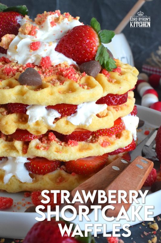Light and airy Strawberry Shortcake Waffles make a perfect weekend brunch item! Prepared with delicious homemade waffles and layered with whipped cream, sliced fresh strawberries, strawberry shortcake crumbs, and syrup, this is one scrumptiously impressive and flavourful treat! #waffles #strawberries #strawberry #shortcake #strawberryshortcake #brunch #stacked