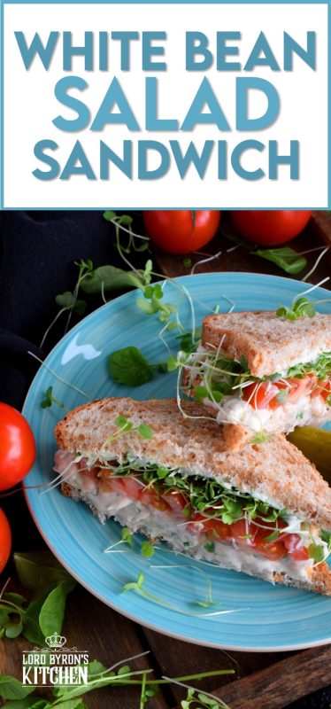 When you mash canned white beans, and combine them with mayo and seasonings, the result is a creamy and tasty vegetarian salad sandwich spread. Top that sandwich with sliced tomatoes, fresh microgreens, and watercress for a very healthy and hearty lunch. #canned #beans #smashed #salad #sandwich #vegetarian #meatless