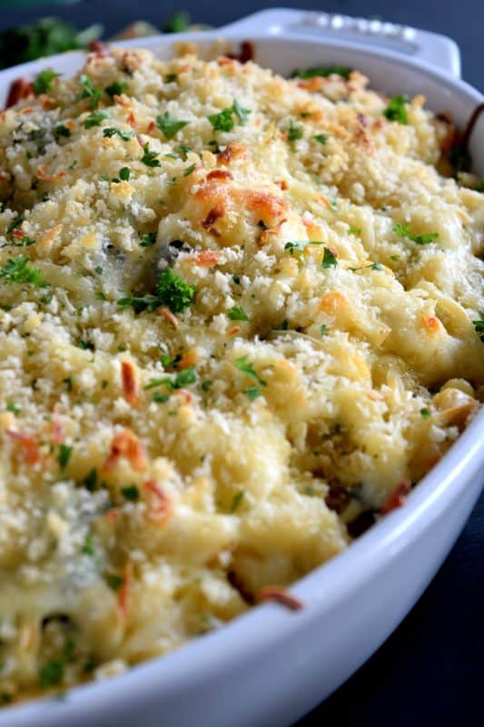 There's nothing wrong with regular mac and cheese, but it simply cannot compare to this Ultimate Spinach and Artichoke Mac and Cheese! It is the cheesiest and the creamiest, with a crispy, crunchy crumb topping. Make no mistake, this cannot be found in a box at the grocer! #spinach #macandcheese #artichoke