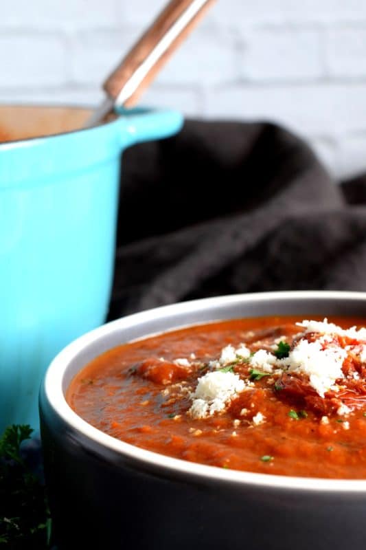 Roasting vegetables intensifies flavour and brings out their natural sweetness. The charred bits will add smokiness and a homestyle flair. It's certainly evident in this Roasted Red Pepper and Tomato Soup! This delicious soup is super thick and hearty; and easy to prepare too! #roasted #redpepper #bellpepper #soup