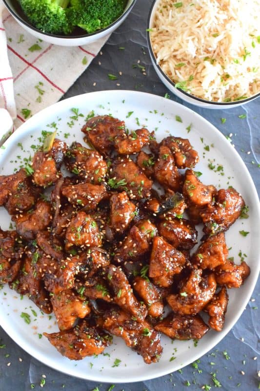 Fried Garlic Chicken is a crispy fried chicken in a thick and savoury garlic sauce; this dish is most certainly for the garlic lover. Prepared with a unique battering technique, and double fried, this chicken is sweet and super garlicky - it's made with twelve cloves of garlic! #garliclovers #garlicky #friedchicken #chicken #thighs