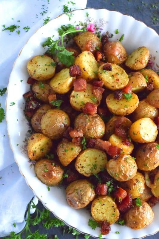 Fast, easy, simple, and delicious is how I would describe these Roasted Pancetta Potatoes. Great for brunch or breakfast, but also a great side dish to a main for dinner. The potatoes are perfectly roasted with a soft, steaming hot interior and a browned, slightly salty and savoury exterior - who wouldn't love that!? #pancetta #roastedpotatoes #potatoes #sidedish