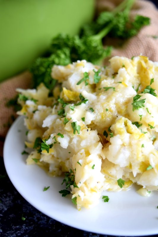 Colcannon is a popular version of Irish mashed potatoes. I make mine with leeks and cabbage which results in a delicious side dish - no gravy needed with these mashed potatoes! #colcannon #stpatricksday #irishrecipes #irish #ireland #mashedpotatoes