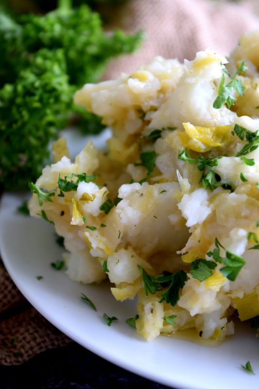 Colcannon is a popular version of Irish mashed potatoes. I make mine with leeks and cabbage which results in a delicious side dish - no gravy needed with these mashed potatoes! #colcannon #stpatricksday #irishrecipes #irish #ireland #mashedpotatoes