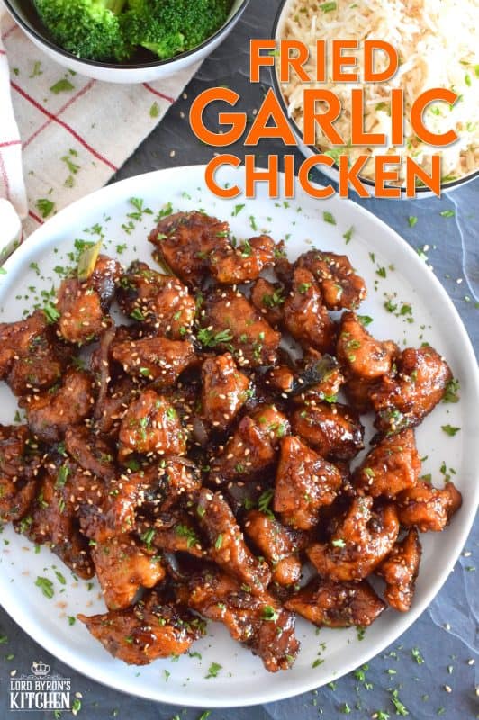 Fried Garlic Chicken is a crispy fried chicken in a thick and savoury garlic sauce; this dish is most certainly for the garlic lover. Prepared with a unique battering technique, and double fried, this chicken is sweet and super garlicky - it's made with twelve cloves of garlic! #garliclovers #garlicky #friedchicken #chicken #thighs