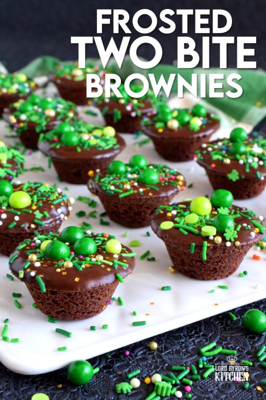 Frosted Two Bite Brownies are for the serious chocolate lover! Dense and moist brownies frosted with the easiest chocolate frosting you'll ever make and topped with sprinkles; you can't eat just one!! #twobite #brownies #frosted #twobitebrownies #stpatricksdayrecipes #greenfood