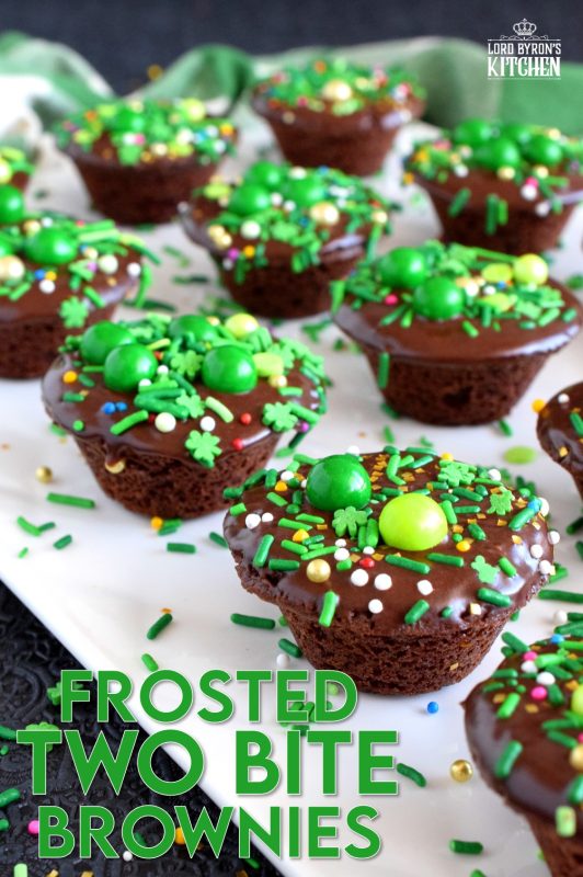 Frosted Two Bite Brownies are for the serious chocolate lover! Dense and moist brownies frosted with the easiest chocolate frosting you'll ever make and topped with sprinkles; you can't eat just one!! #twobite #brownies #frosted #twobitebrownies #stpatricksdayrecipes #greenfood