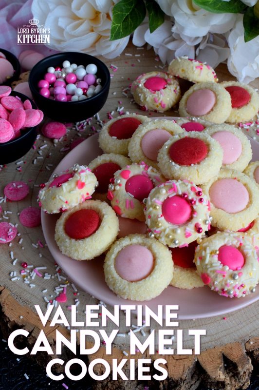 Similar to a classic thumbprint cookie, these valentine cookies use candy melts instead of jam. Makes a great valentine treat for that special someone! #valentine #pink #cookies #candy #melts @wilton