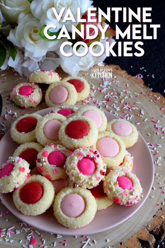 Similar to a classic thumbprint cookie, these valentine cookies use candy melts instead of jam. Makes a great valentine treat for that special someone! #valentine #pink #cookies #candy #melts @wilton