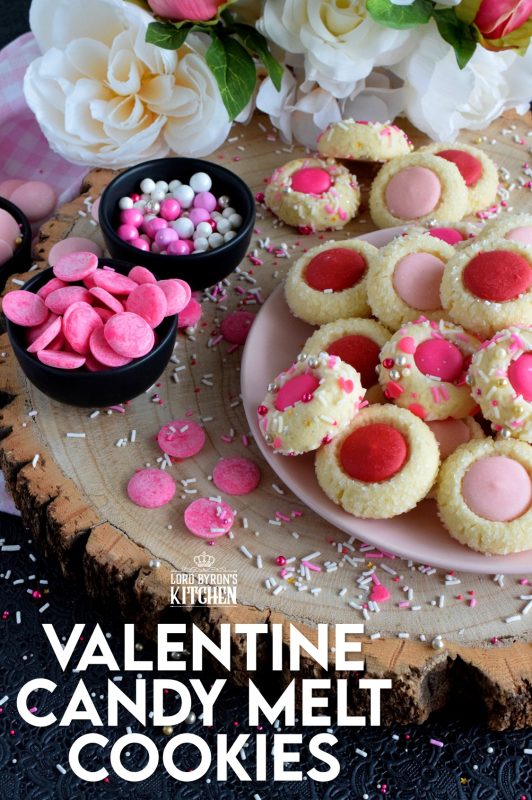 Similar to a classic thumbprint cookie, these valentine cookies use candy melts instead of jam. Makes a great valentine treat for that special someone! #valentine #pink #cookies #candy #melts @wilton