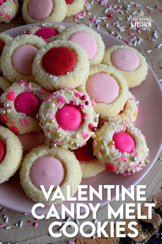 Similar to a classic thumbprint cookie, these valentine cookies use candy melts instead of jam. Makes a great valentine treat for that special someone! #valentine #pink #cookies #candy #melts @wilton