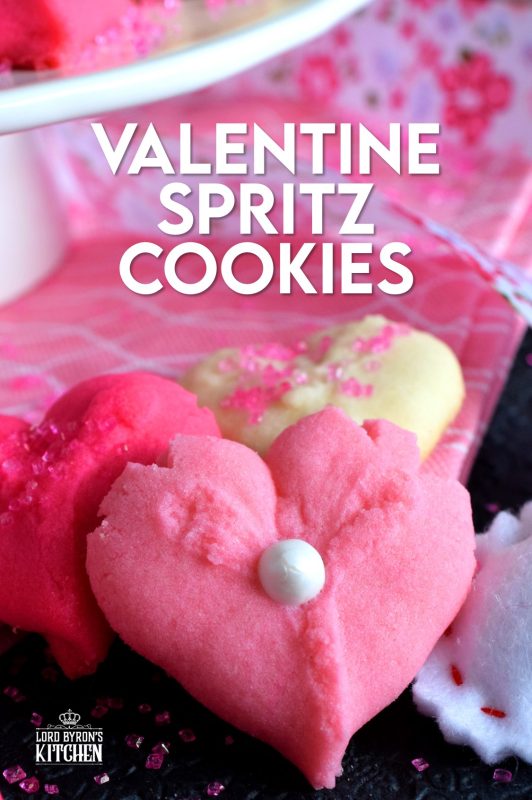 Valentine Spritz Cookies are bright, cheerful, and will bring a smile to anyone's face. These are so easy to make and so delicious too! Break out your sprinkles and have some fun!! #valentinebaking #valentinecookies #pinkrecipes #spritzcookies #cookies #valentinetreats