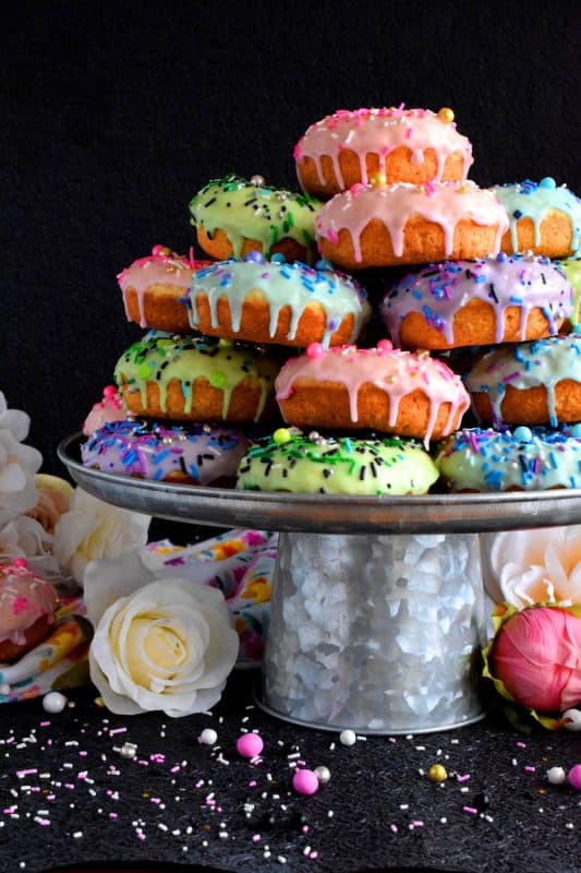 Who doesn't get excited when they see a big pile of donuts? Sure, you could go to your favourite pastry shop, but you can easily make your own donuts at home. This Stacked Donut Cake is proof of that! And, it's perfect for any occasion! #donuts #homemade #stackedcake #donutcake