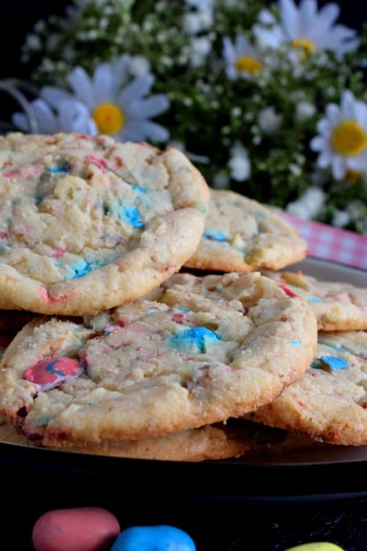 Spark conversation with this controversially named treat! This not-so-perfect chewy cookie with crispy edges is filled with chocolate malted balls. Prepare a batch of these Easter Bunny Roadkill Cookies and watch for reactions when you suggest that the Easter Bunny has been run over by a truck! #Easter #Bunny #roadkill #cookie #malted #chocolate #balls