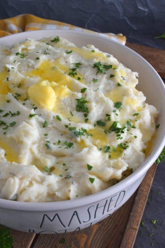 Mashed Potatoes are everyone's favourite comfort food and side dish, which is what makes it the most common side dish in many homes and on many occasions.  But, boring mashed potatoes are a thing of the past!  Add lots of fresh herbs and butter to make them extraordinary! #mashedpotatoes #potatoes #herbbutter #freshherbs #herbs
